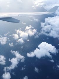 Low angle view of airplane flying in sky