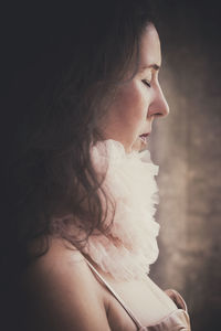 Close-up of young woman looking away