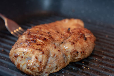 High angle view of meat on barbecue grill