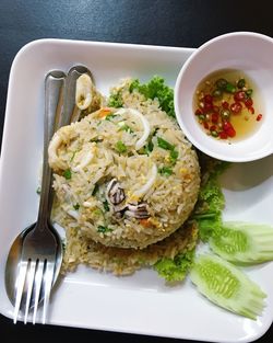 High angle view of meal served in plate on table