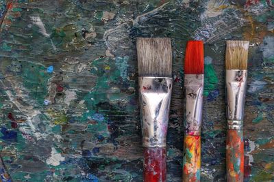 Directly above shot of paintbrushes on table