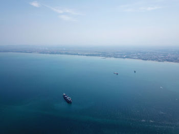 A container ship at penang sea. back is peninsular malaysia.