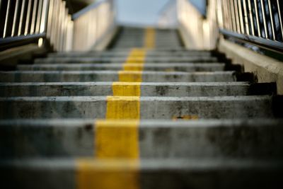 Blurred cement stairs with yellow line and texture background