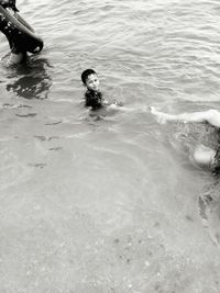 Boy swimming in sea