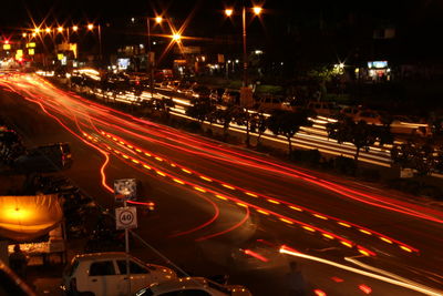 High angle view of light trails on city street at night