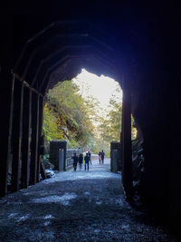 People walking in tunnel