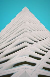 Low angle view of modern building against clear blue sky