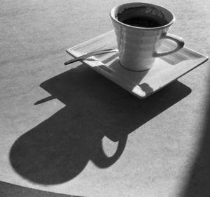 Close-up of coffee cup on table