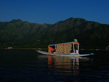 Boat in sea against sky