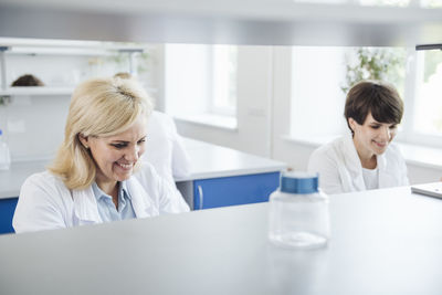 Smiling researcher working in laboratory