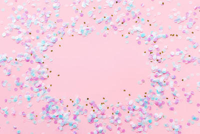 Close-up of pink balloons against blue background