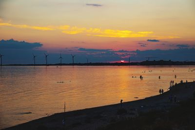 Scenic view of sea against orange sky