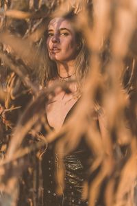 Portrait of young woman standing outdoors