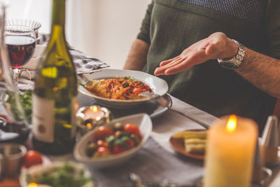 Midsection of man having food