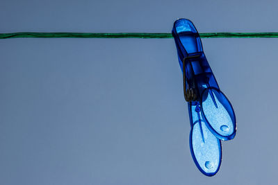 Close-up of boat against blue sky