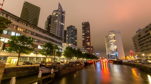 Illuminated buildings in city at night