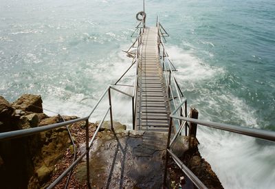 High angle view of staircase by sea