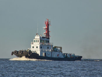 Ship in sea against clear sky