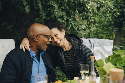 Couple kissing against blurred background