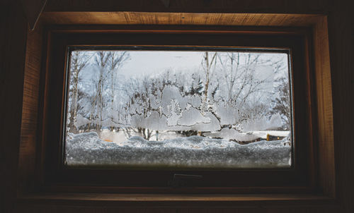 Close-up of glass window of house