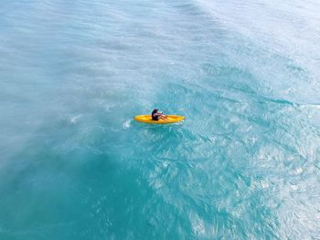 High angle view of man kayaking in sea