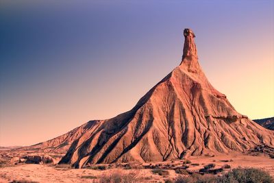 Rock formation in desert against clear sky