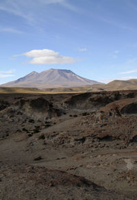 Scenic view of landscape and mountains against sky