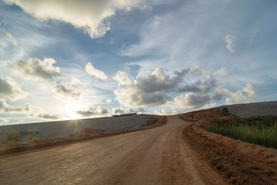 Road amidst landscape against sky