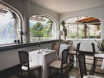 Empty chairs and tables in restaurant