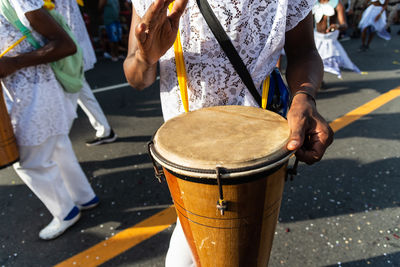 Musicians are seen playing percussion instruments during fuzue, pre carnival 