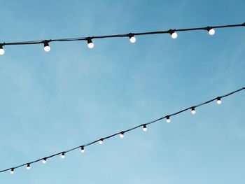 Low angle view of street light against sky