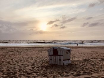 Scenic view of beach against sky during sunset