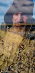 Close-up portrait of man climbing on land