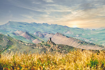 Scenic view of landscape against sky during sunset