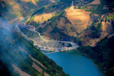 High angle view of river amidst mountains