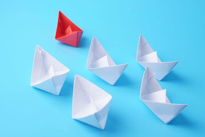 High angle view of paper flag on blue table