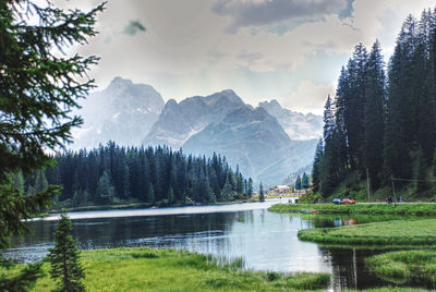 Scenic view of lake and mountains against sky