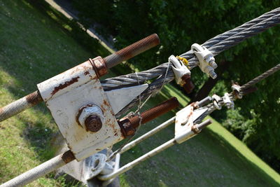 Close-up of nuts and bolts with steel cable in park