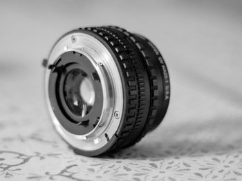 Close-up of camera lens on table