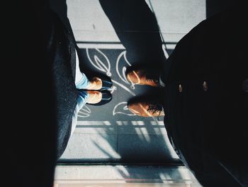 Low section of people on tiled floor