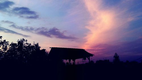 Built structure against sky at sunset