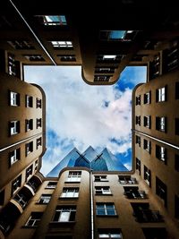 Low angle view of office building against sky