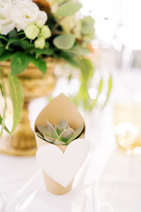 Close-up of wedding rings on table