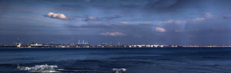 City by sea against sky