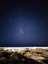 Scenic view of sea against sky at night