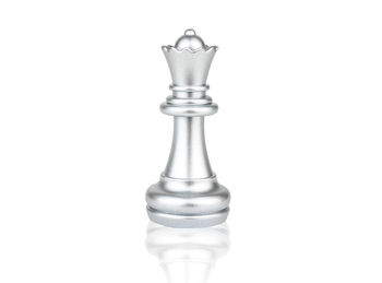 Close-up of chess pieces against white background