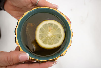 Midsection of man holding drink