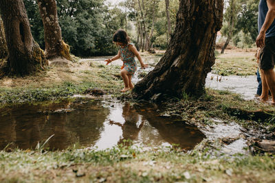 Father with children in the river