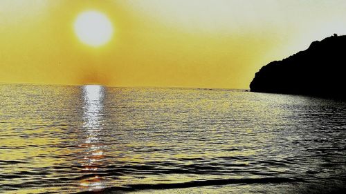 Scenic view of sea against dramatic sky