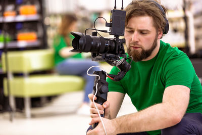 Close-up of man holding camera